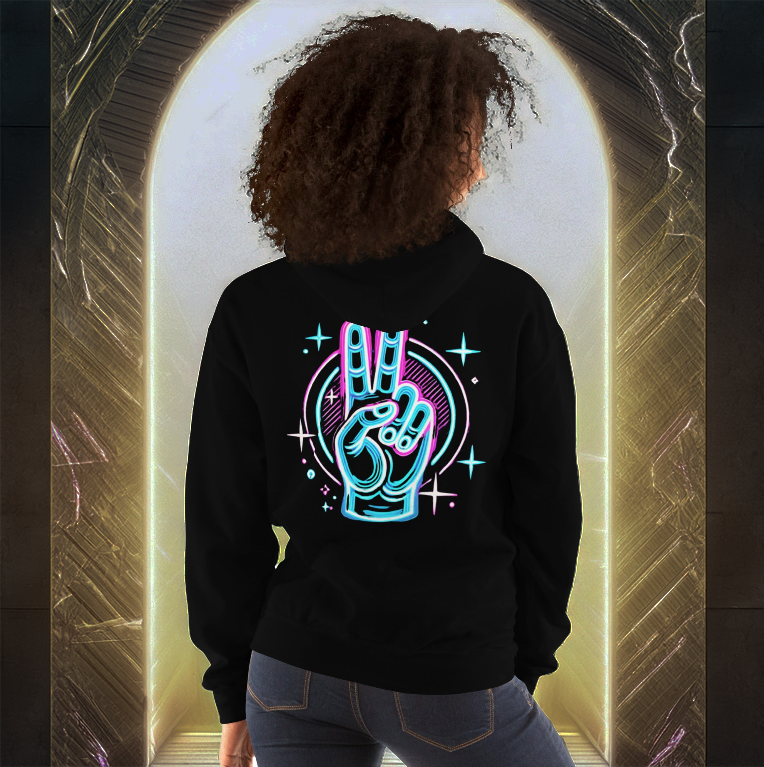 Woman wearing a black hoodie featuring a neon peace hand sign design on the back, standing in front of a glowing golden portal.