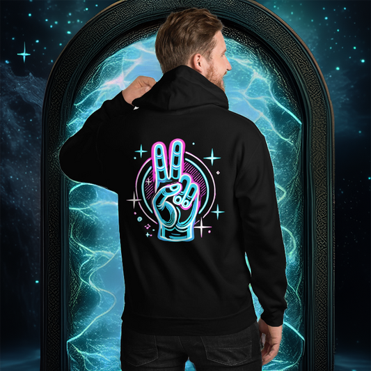 A man wearing a black hoodie with a neon-inspired peace hand sign design on the back, featuring glowing blue and pink hues, geometric elements, and sparkles. He stands in front of a glowing mystical portal with an ethereal blue light.