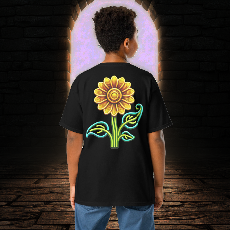 Boy wearing the Eclipsed Sunflower Youth Tee in black, featuring a vibrant neon sunflower design on the back, standing before a glowing arched doorway in a mystical stone setting.